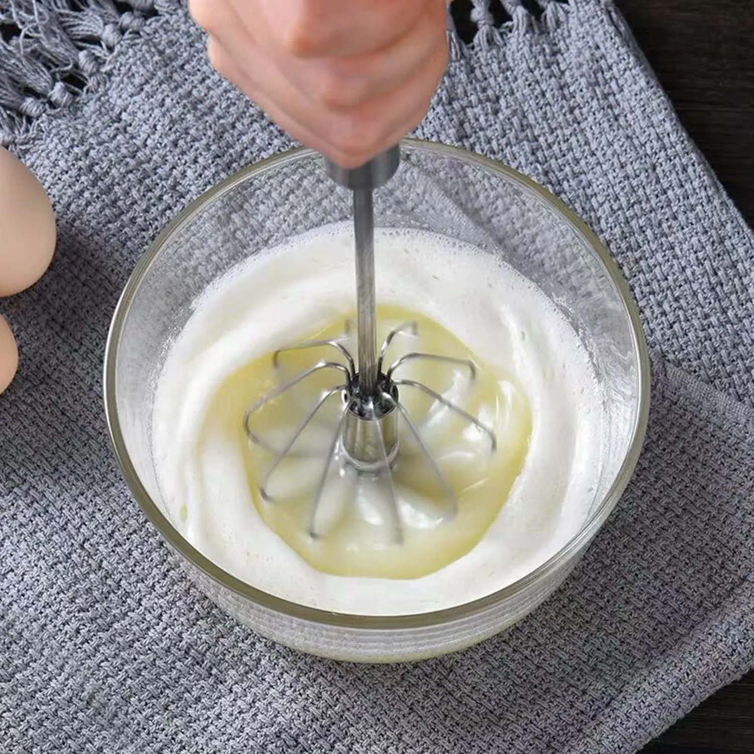 Whipping liquid egg whites and cream into foam